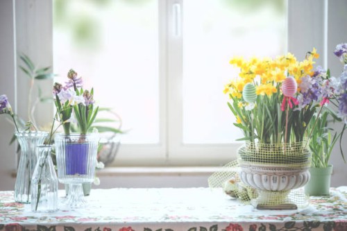 still life background with springtime flowers and easter eggs on kitchen table at window background - home decoration stock pictures, royalty-free photos & images