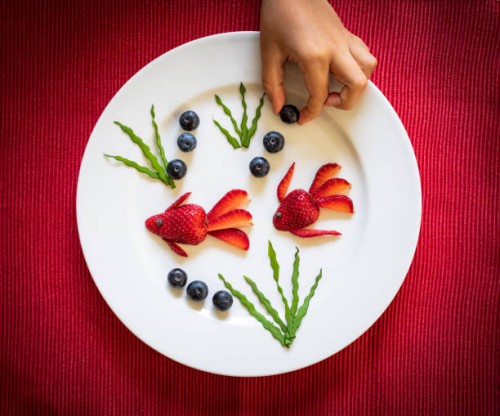 strawberries in shape of fish food creation, flat lay - food stock pictures, royalty-free photos & images