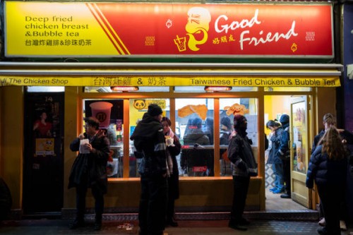 Street scene in Chinatown outside and looking in to a Taiwanese fried chicken and bubble tea take away estaurant on 17th January 2024 in London,...