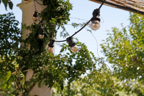 string of light bulbs at terrace - garden decoration stock pictures, royalty-free photos & images