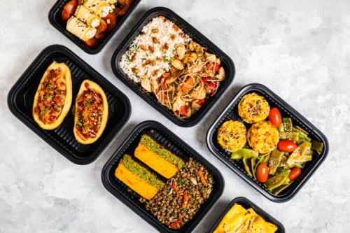 studio shot of variety of take out food including chop suey, stuffed potatoes, fajitas, rice muffins, ricotta rolls, various salads and terrine - junk food stock pictures, royalty-free photos & images