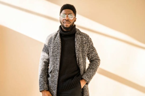 stylish african american man in glasses posing at camera - fashion stock pictures, royalty-free photos & images