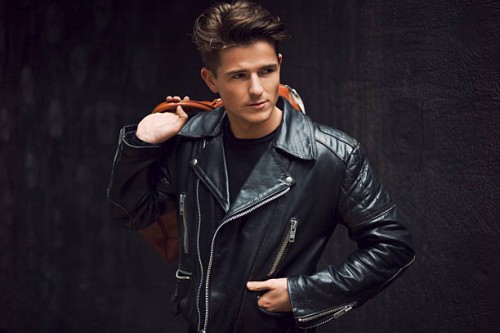 stylish man carrying a leather bag - fashion stock pictures, royalty-free photos & images