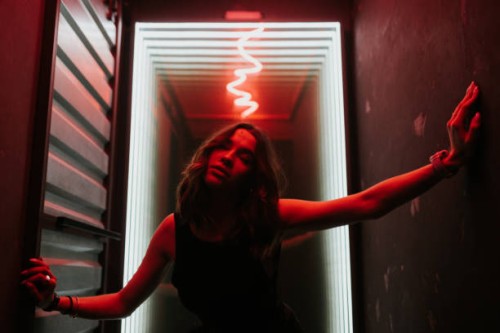 stylish portrait of the beautiful woman in the red light - fashion stock pictures, royalty-free photos & images