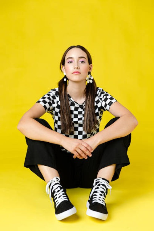 stylish woman in front of plain background - fashion stock pictures, royalty-free photos & images