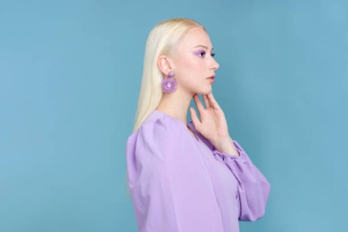 stylish woman in purple in dress - fashion stock pictures, royalty-free photos & images