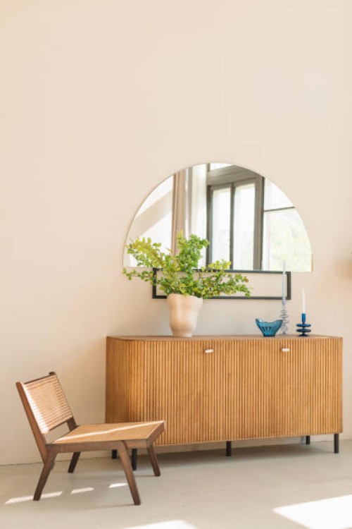 stylish wooden chair next to a sideboard in a modern living room - home decoration stock pictures, royalty-free photos & images