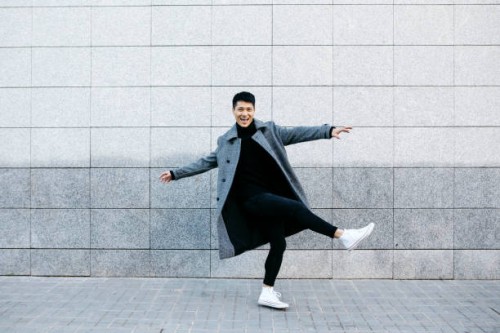 stylish young man dancing on the street - fashion stock pictures, royalty-free photos & images