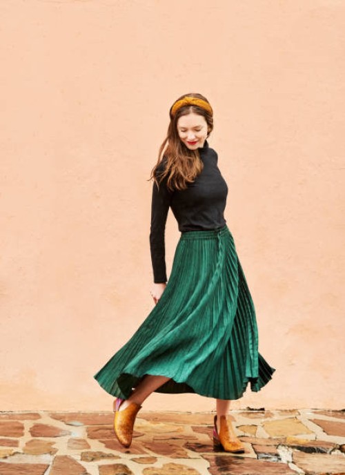 stylish young woman walking outside - fashion stock pictures, royalty-free photos & images