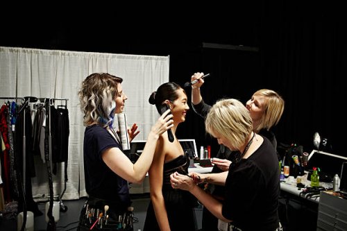 stylists and model backstage at fashion show - fashion week stock pictures, royalty-free photos & images
