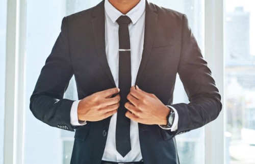 success matches perfectly with a stylish suit - fashion stock pictures, royalty-free photos & images