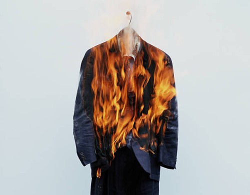 suit on hanger burning - fashion stock pictures, royalty-free photos & images