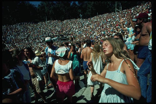 Sun-drenched fans dance to the music of the Grateful Dead at a concert in Berkeley's Greek Theater. Berkeley, California, USA.