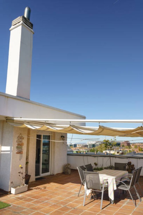 sunny terrace with vintage decoration and white awning over blue sky - garden decoration stock pictures, royalty-free photos & images