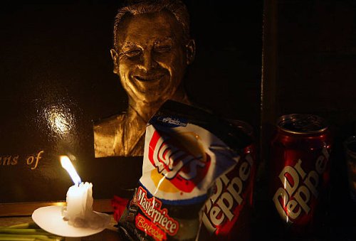 Surrounded by his favorite junk food, deputy David March's image is illuminated as family friends and colleagues gather, Tuesday, April 29 for a...
