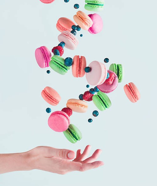 sweets for a stage magician: flying macarons - food stock pictures, royalty-free photos & images