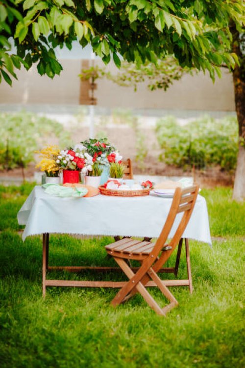 table with easter decor on the grass in the backyard garden - garden decoration stock pictures, royalty-free photos & images