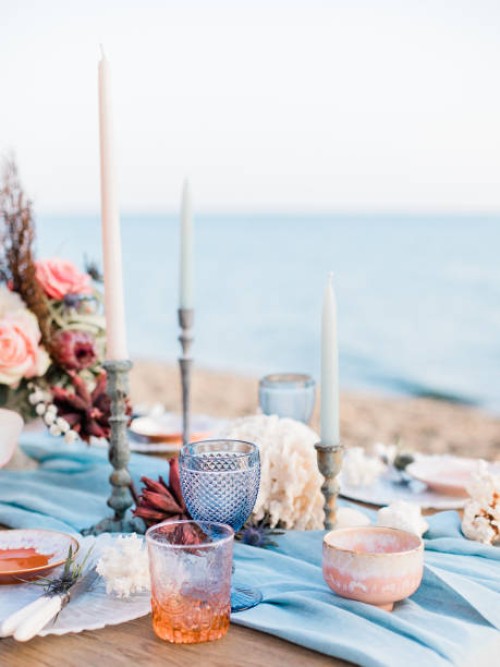 tablescape for a beach wedding in santorini with coral and blue details - home decoration stock pictures, royalty-free photos & images