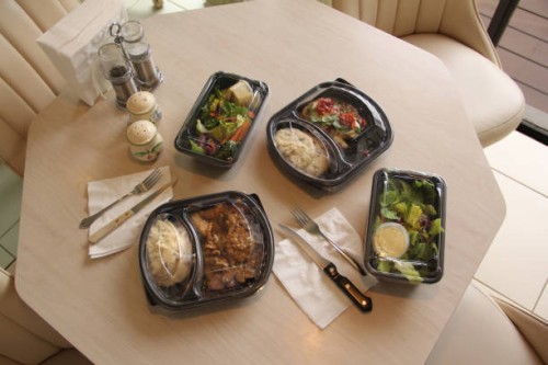 take-out meals at home on kitchen table - junk food stock pictures, royalty-free photos & images