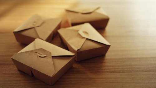 take away food in recycled paper container on dining table - junk food stock pictures, royalty-free photos & images