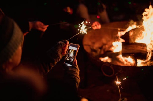 taking a photo of sparklers - garden decoration stock pictures, royalty-free photos & images