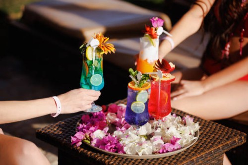 taking various cocktails from tray decorated with petals on bar table - home decoration stock pictures, royalty-free photos & images