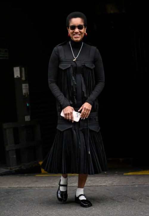 Tamu McPherson is seen wearing a black Sacai ruffled outfit outside the Sacai show during Womenswear Spring/Summer 2025 as part of Paris Fashion Week...