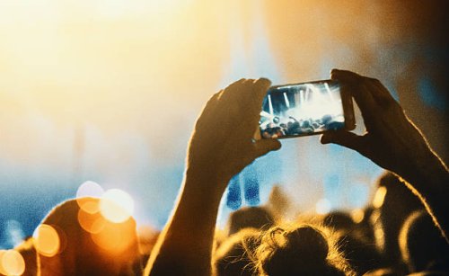 taping a concert with smartphone. - concert stock pictures, royalty-free photos & images