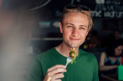 tasting the local cuisine - junk food stock pictures, royalty-free photos & images