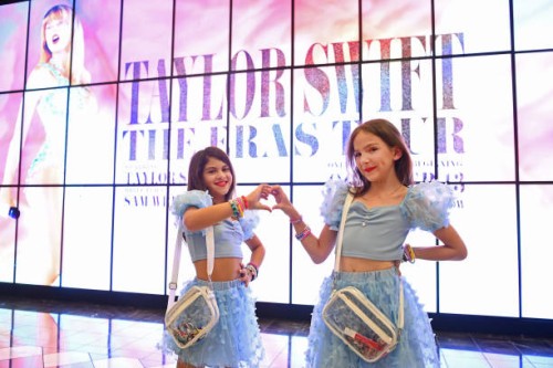 Taylor Swift fans, aka Swifties, are dressed as Taylor Swift and wear Taylor Swift concert tee shirts at The World Premiere of "Taylor Swift: The...