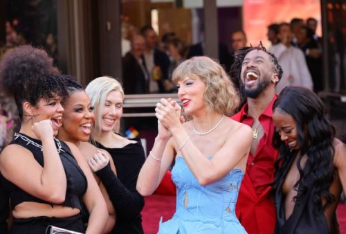 Taylor Swift with dancers and crew attend "Taylor Swift: The Eras Tour" Concert Movie World Premiere at AMC The Grove 14 on October 11, 2023 in Los...