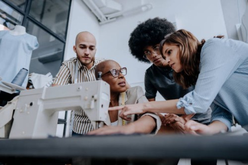 teaching to sew fashion studio - fashion stock pictures, royalty-free photos & images