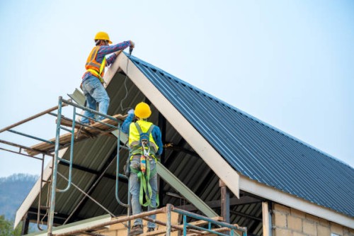 technician working on roof metal cheese in construction site. - home decoration stock pictures, royalty-free photos & images