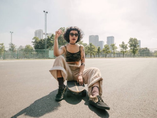 teen girl with longboard in the skateboard park. - fashion stock pictures, royalty-free photos & images