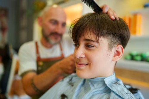 teenage boy having a haircut at the barber shop - hairstyle stock pictures, royalty-free photos & images