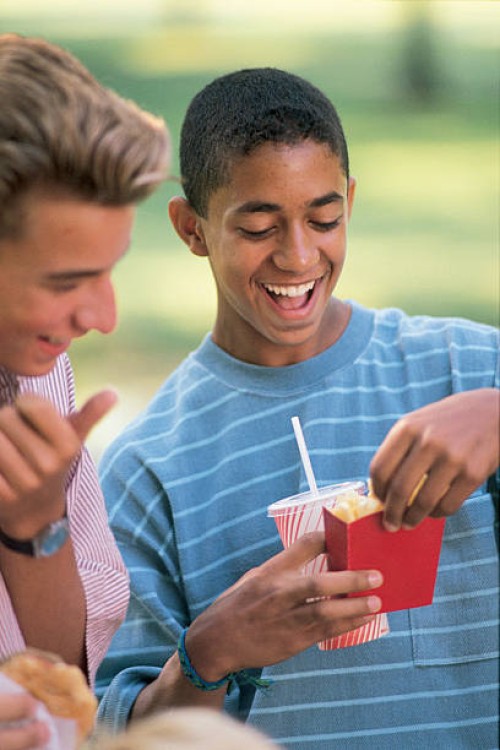 teenage boys with fast food - junk food stock pictures, royalty-free photos & images