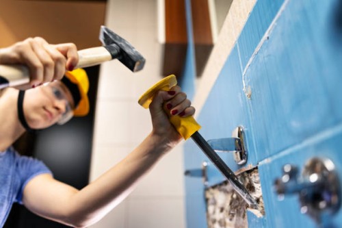 teenage girl doing some home demolition - renovation - home decoration stock pictures, royalty-free photos & images