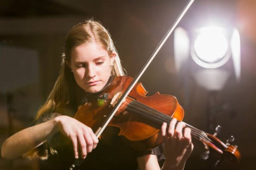 teenage girl playing the violin in concert - concert stock pictures, royalty-free photos & images