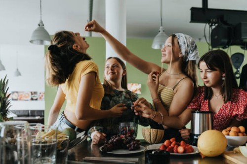 teenage girls trying fresh fruit for smoothies - food stock pictures, royalty-free photos & images