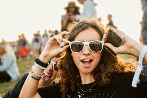 teenagers goofing around at music festival - concert stock pictures, royalty-free photos & images