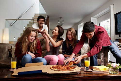 teenagers having take away pizza - junk food stock pictures, royalty-free photos & images