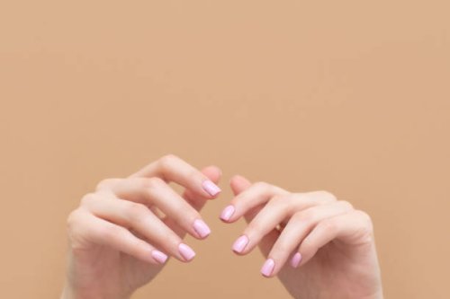 tender hands with perfect blue and pink manicure on trendy pastel pink background. place for text. - nails art stock pictures, royalty-free photos & images