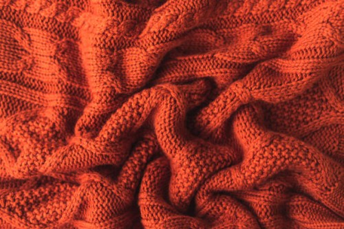 texture of a knitted red brown sweater with pleats. flat style, close-up. - home decoration stock pictures, royalty-free photos & images