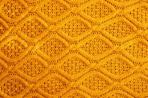 texture of warm knitted sweater. backdrop in yellow color. - home decoration stock pictures, royalty-free photos & images