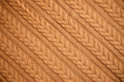 texture of warm knitted sweater. backdrop in brown color. - fashion stock pictures, royalty-free photos & images