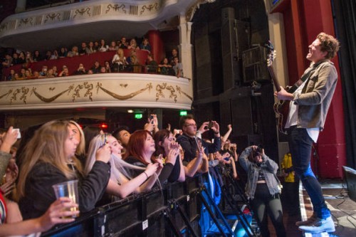 The crowd watch on as Joel Peat of Lawson performs solo at O2 Shepherd's Bush Empire on October 23, 2018 in London, England.