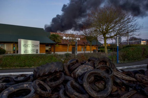 The entrance of a McDonald fast food is blocked by farmers in Le Mans, northwestern France, on January 26 as part of a nationwide day of protests...