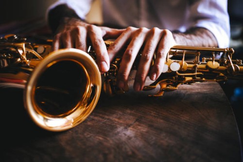the hands of the saxophone player - concert stock pictures, royalty-free photos & images