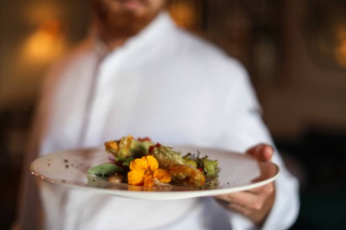 the head chef at a gourmet restaurant preparing for dinner service. - food stock pictures, royalty-free photos & images