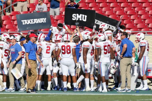 The SMU Mustangs defense celebrates a takeaway during the College Football game between the SMU Mustangs and the South Florida Bulls on September 28,...